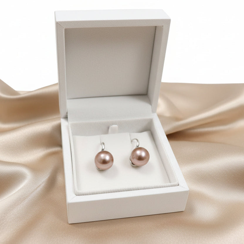 Pair of purple freshwater pearl earrings in a jewelry box